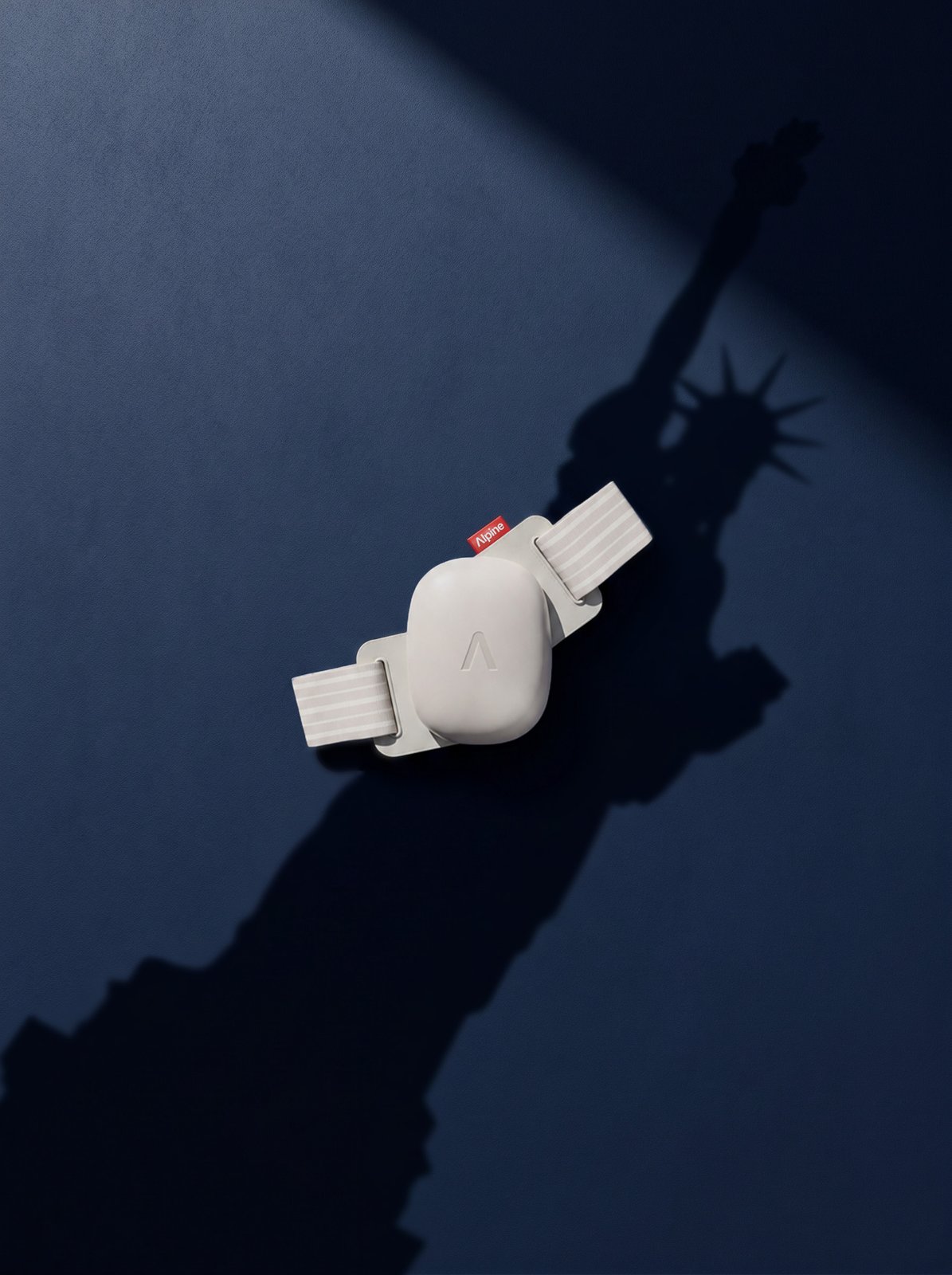 Alpine earplugs casting a Statue of Liberty shadow